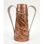 Newlyn school, Cornwall, beaten copper twin handled vase with stylised fish amongst seaweed in