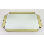 Art Deco wall hanging mirror in clear mirror glass bordered by yellow tinted panels, 65 x 40cm