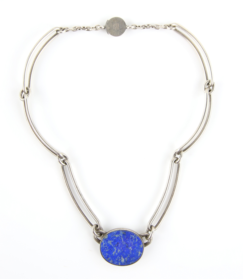 Niels Erik From necklace, central oval lapis lazuli panel 2.8 x 2.4cm, set in silver bevelled mount,