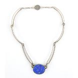 Niels Erik From necklace, central oval lapis lazuli panel 2.8 x 2.4cm, set in silver bevelled mount,
