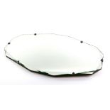 Art deco mirror with faceted border and crown shaped metal clasps, 68 x 41cm