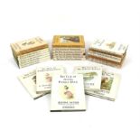 Small group of books including The Tales of Peter Rabbit The English Review and Illustrated