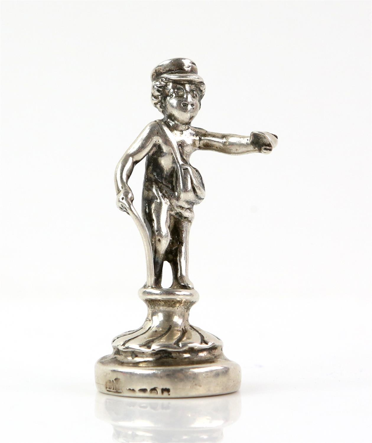 Novelty silver desk top letter seal in the form of a young man with a walking stick holding a piece