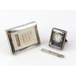 Silver framed desk calendar, a silver fronted clock and a silver cased letter opener