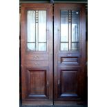 Pair of Art Deco oak cabinets, each with single door with bevelled glass panels, H212 x W65 x D40cm