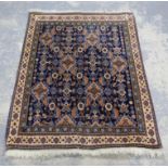 Persian rug with six diamond medallions and all over floral design on a blue ground within floral
