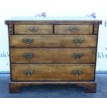 Bachelor's oak chest of four long graduating drawers, with fold over top, on bracket feet,