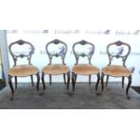 Set of four rosewood dining chairs, with stuff-over seats on cabriole legs