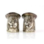 Novelty pair of silver cruets, salt and pepper pots in the form of Peruvian natives heads,