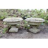 Pair of composite stone planters of urn form, H32cm Diameter 49cm