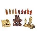Four Chinese carved soapstone seals with figural surmounts, red stained resin figures and other