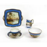 Noritake tea service for 12, with painted decoration of swans on a lake, blue band to border,