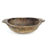 Large carved wooden tribal bowl, H21 x W75cm