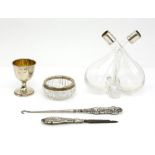 Silver collared oil pourer, Chester 1922 and a silver egg cup and other silver mounted items (5)