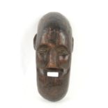 Early 20th century West African carved wooden tribal mask, possibly from the Bambara people, Mali,