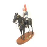 Royal Doulton 'Blues and Royals' figurine, on wooden plinth