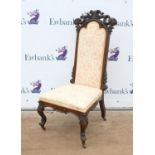 Victorian mahogany nursing chair, carved and pierced floral decoration, with floral upholstery,
