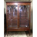 Early 20th century inlaid mahogany display cabinet, the dentil cornice above two astragal glazed