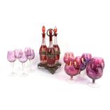 AMENDED DESCRIPTION Set of six amethyst glass brandy glasses, set of five similar wine glasses,