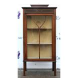 Early 20th century mahogany glazed display cabinet with satinwood line inlay on tapered supports.