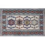 Two kelim rugs to include one with four medallions on a cream ground within border with geometric