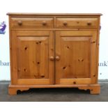 Modern pine sideboard with two short drawers above a cupboard. 87W x 48D x 84H cm