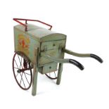 Swallow Bakery grey and red line painted hand cart, with metal wheels, the interior with loaves and
