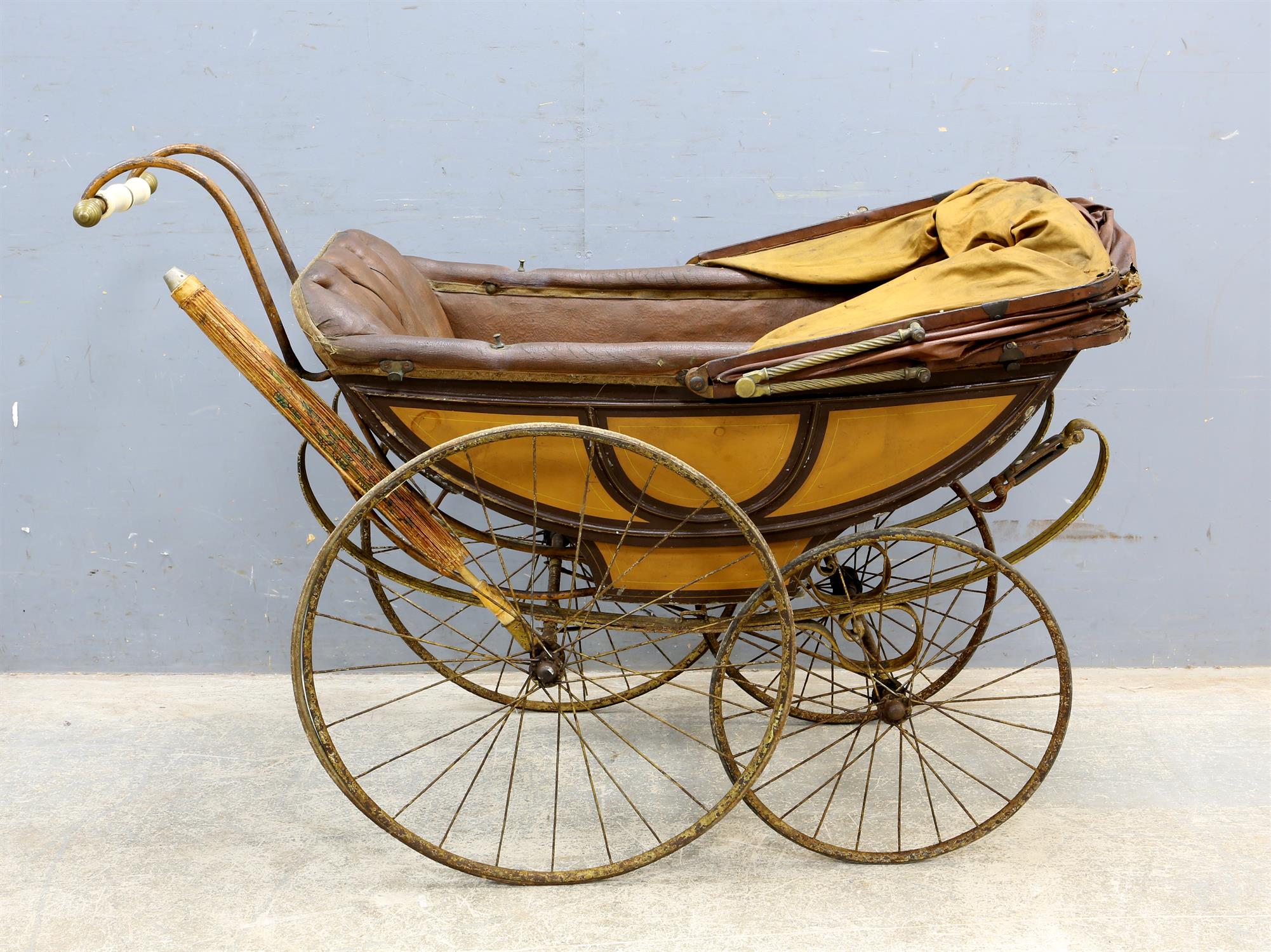 Simmons & Co., metal sprung, wood and leather dolls pram with metal spokes and solid rubber tyres, - Image 2 of 5