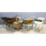 Simmons & Co., metal sprung, wood and leather dolls pram with metal spokes and solid rubber tyres,