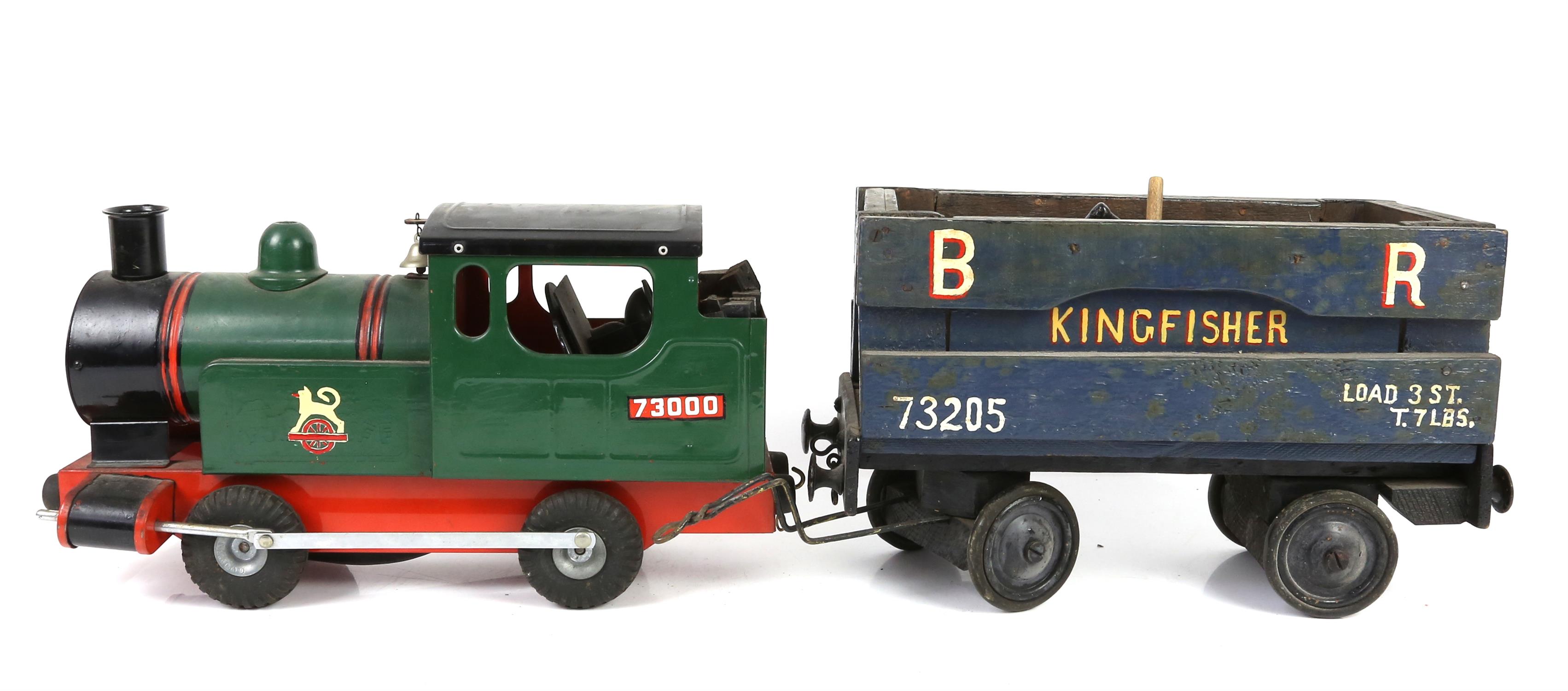 Cast metal model locomotive with rubber wheels and a similar goods wagon, other train related items