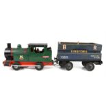 Cast metal model locomotive with rubber wheels and a similar goods wagon, other train related items