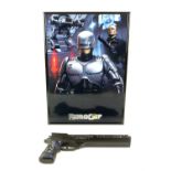 Robocop (1987) plastic gun in framed display, hand signed in silver by Peter Weller "ROBO Your Move