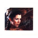Star Wars - Carrie Fisher signed colour photo, overall 28 x 33 cm. Provenance: Signed for the