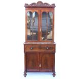 19th century mahogany secretaire bookcase, the cornice with shell and scrolling foliage above three