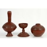 Three Turkish Tophane red pottery vessels, to include footed vase with elongated neck with stylised