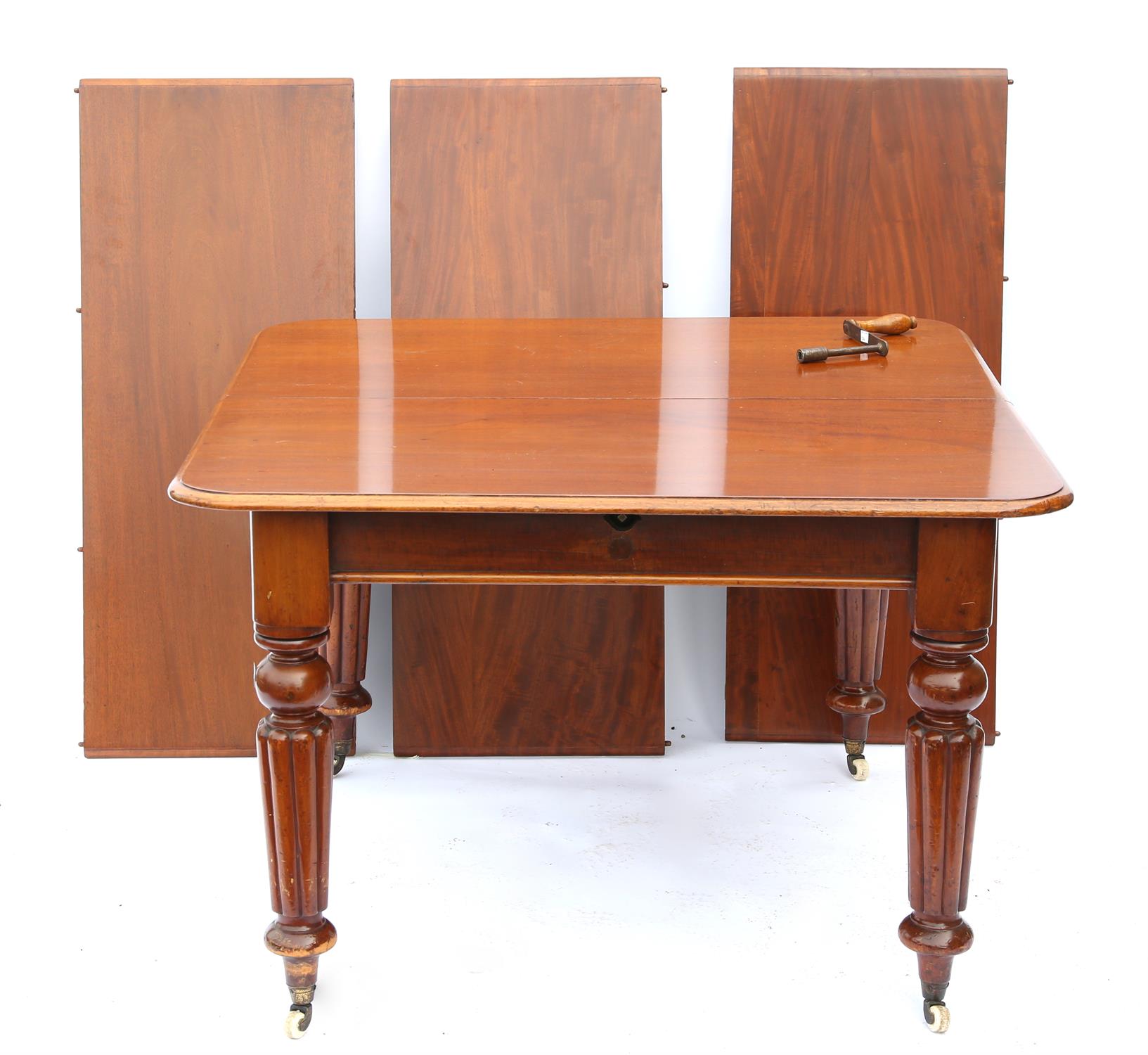 19th century mahogany extending dining table with three extra leaves, on reeded legs and castors, - Image 2 of 2