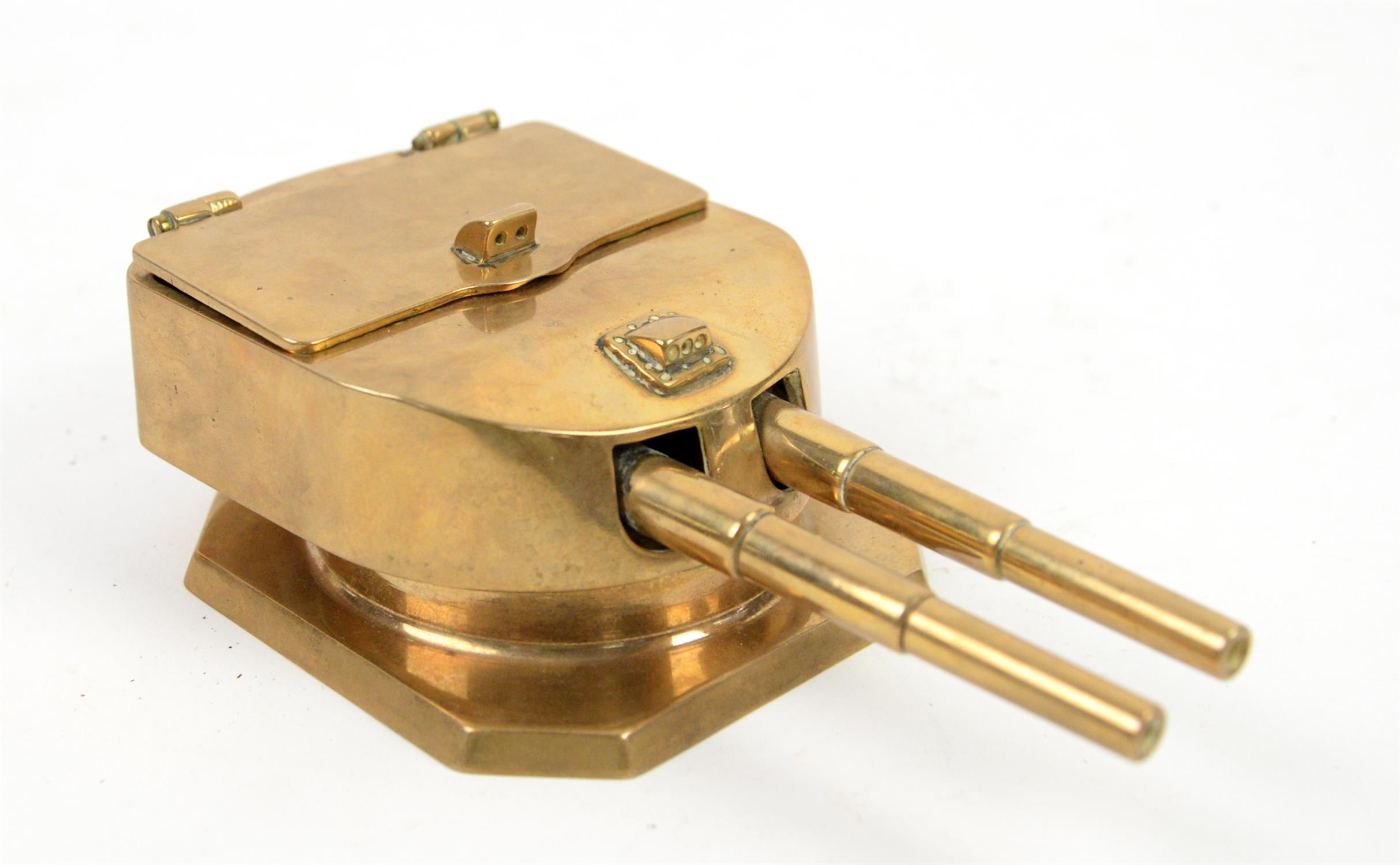 Brass inkwell in the form of a naval gun turret, lid interior marked 'Cast from metal,