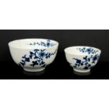 Two early Worcester blue and white tea bowls, crescent marks to bases, 10cm diam and 7.5cm diam