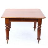 19th century mahogany extending dining table with three extra leaves, on reeded legs and castors,