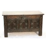 18th century oak coffer with carved panelled front on square supports, h75cm x w131cm x d57cm,