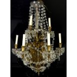 Nine branch gilt metal and glass chandelier with scrolling floral branches and glass drops,