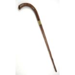 Early 20th century wood sheathed and brass mounted swordstick, 94cm long,
