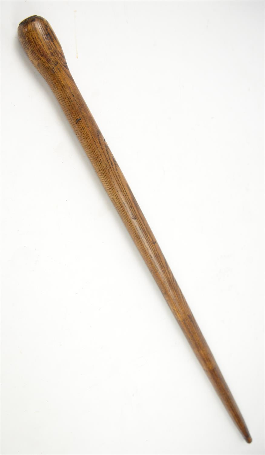 Early 20th century ash flick stick with brass mount and steel spike, 92.5cm long with spike in