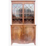 19th century mahogany glazed bookcase, the moulded cornice above astragal glazed doors revealing