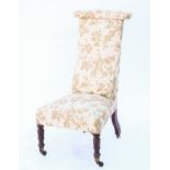 Late 19th century mahogany prie dieu, with floral upholstery on turned legs and castors, H104cm