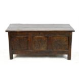 18th century oak coffer of plank construction, with later decoration, on square feet,
