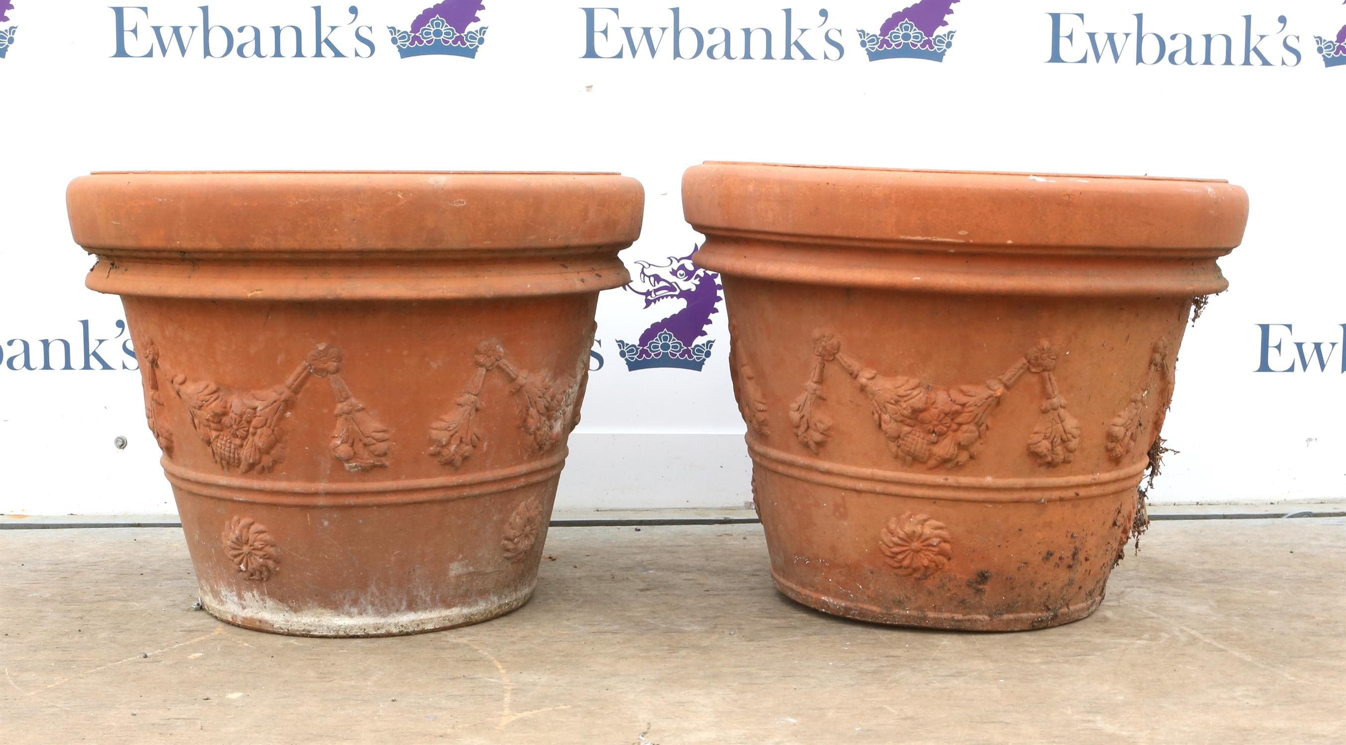 Two large hand-made Italian terracotta planters, decorated with floral swags, stamped to interior,