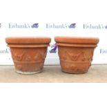 Two large hand-made Italian terracotta planters, decorated with floral swags, stamped to interior,