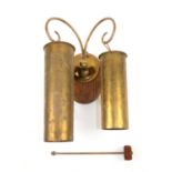 Wall mounted dinner gong, with two brass artillery shell cases on wall plaque with scrolling hooks,