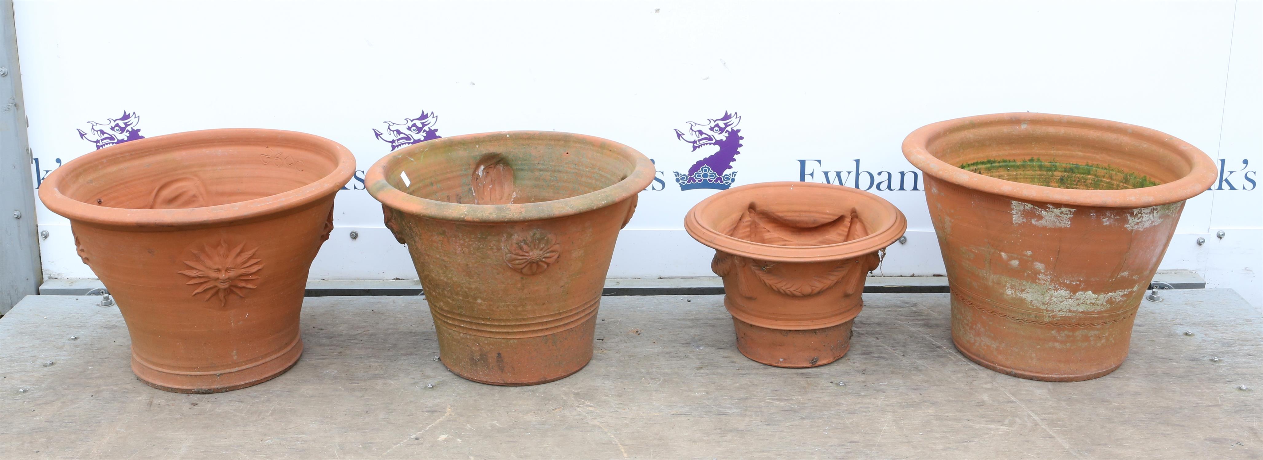 Four terracotta planters of circular tapering form, in differing sizes, H37cm Diameter 53cm,